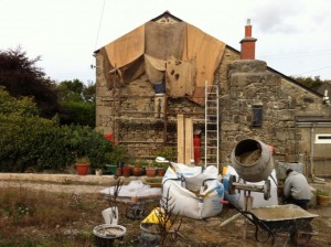 Covering the work with wet Hessian.  This stops the sun and wind drying the work and rain washing it out.