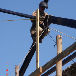 The local welder doing a wonderful job welding up the roof steels