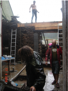 Casting the concrete lintel through the wall. The pillar you can see is to take the floor joist and is solidly fixed into the pad and the reinforcement all adding to the structural strength. You can see the timber shuttering forming the lintel.