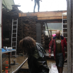 Casting the concrete lintel through the wall. The pillar you can see is to take the floor joist and is solidly fixed into the pad and the reinforcement all adding to the structural strength. You can see the timber shuttering forming the lintel.