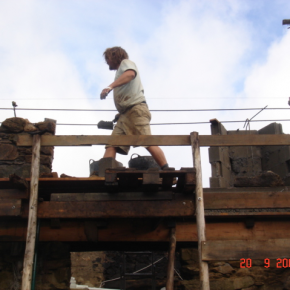 Here you can see the block work being faced off in local stone. Rue built the scaffolding out of local eucalyptus.