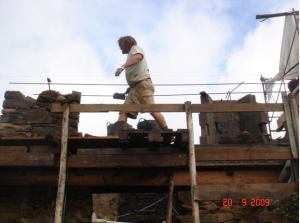 Here you can see the block work being faced off in local stone. Rue built the scaffolding out of local eucalyptus.