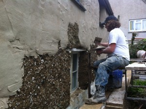 Lime render to cob cottage