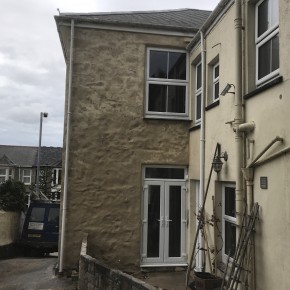 Bag rubbed section of wall to cure damp problem.